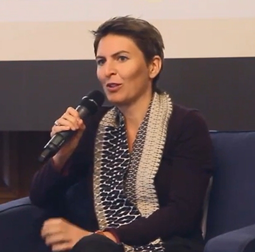 Anna Heringer seated and speaking into a microphone