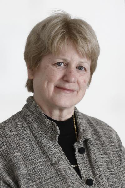 Mary-Claire King in a gray jacket against a light background